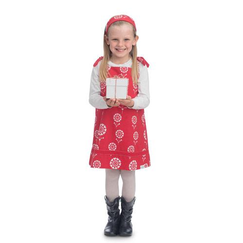 A young Canadian girl wearing a red dress carries a white gift box.