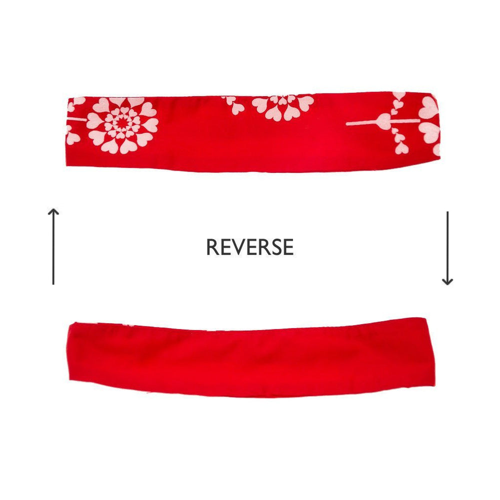An image showing the front and reverse side of a piece of red fabric.